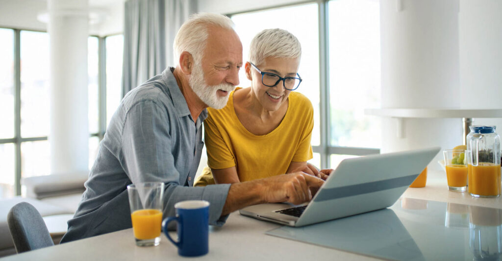 Mature couple buying some goods online